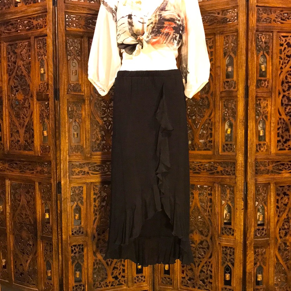 Black Skirt with High-Low Hemline and front slit with cascading ruffles.